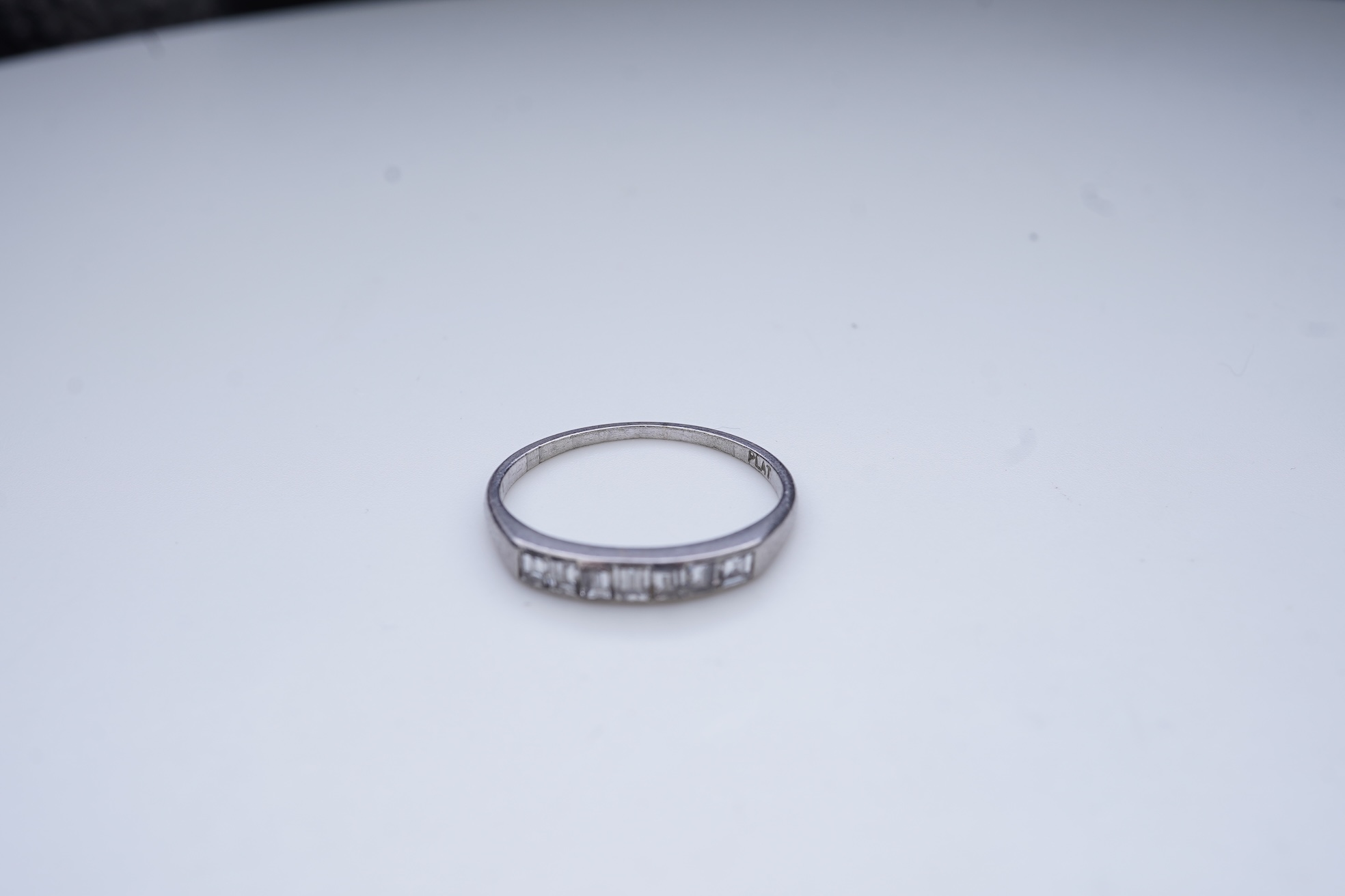 A diamond half-eternity ring, first half 20th century